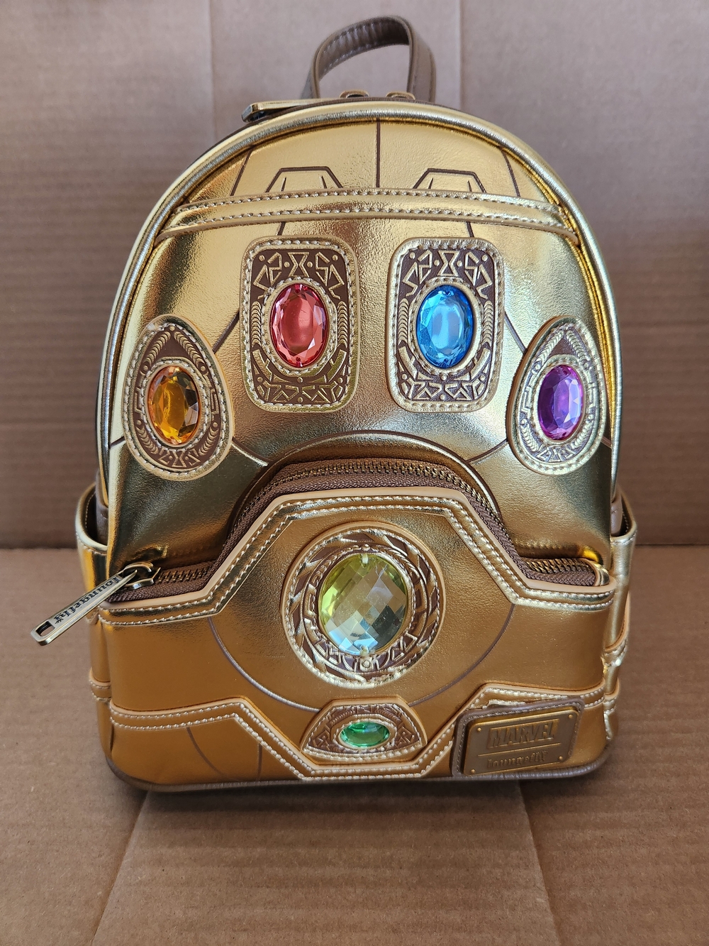 The Disney Parks x Loungefly Marvel Infinity Stones Gauntlet Mini Backpack